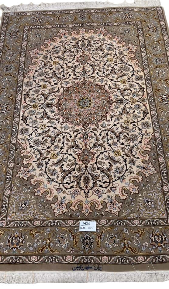 "Luxury Persian rug with wool and silk blend, showcasing intricate arabesque patterns."